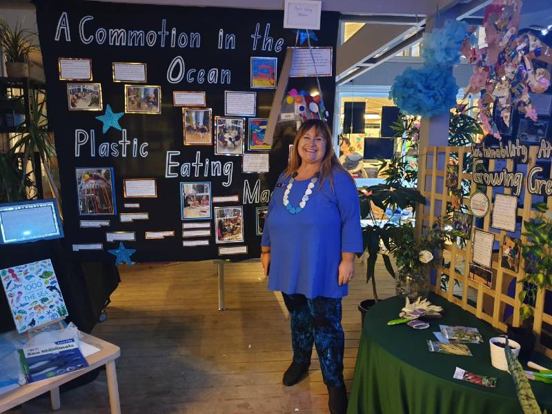 Senior Education Officer Rita Kusevskis-Hayes in front of the Commotion in the Ocean display