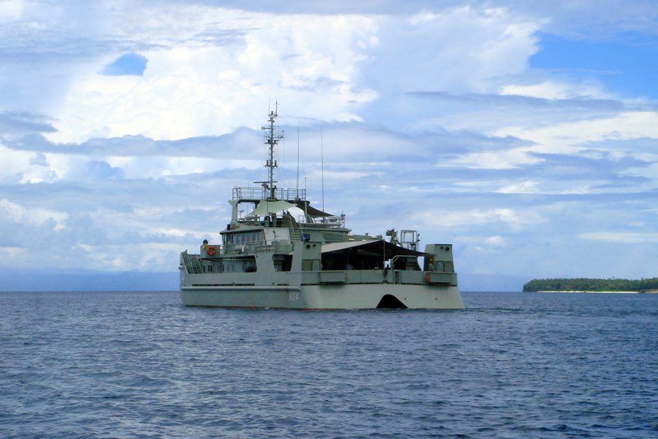 HMAS Benalla conducts a multi-beam sonar survey for AE1 off Mioko Island, February 2007. Photographer: Gus Mellon/Find AE1 Ltd.