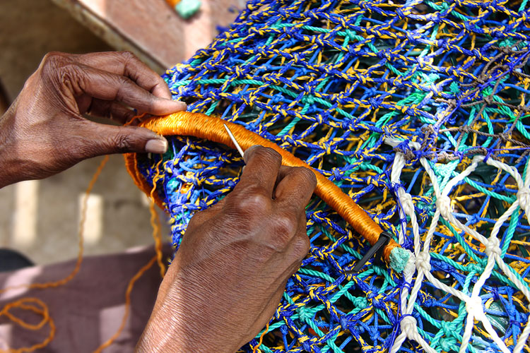 The sculptures are handmade with vibrantly coloured fishing nets. Image: Erub Arts.