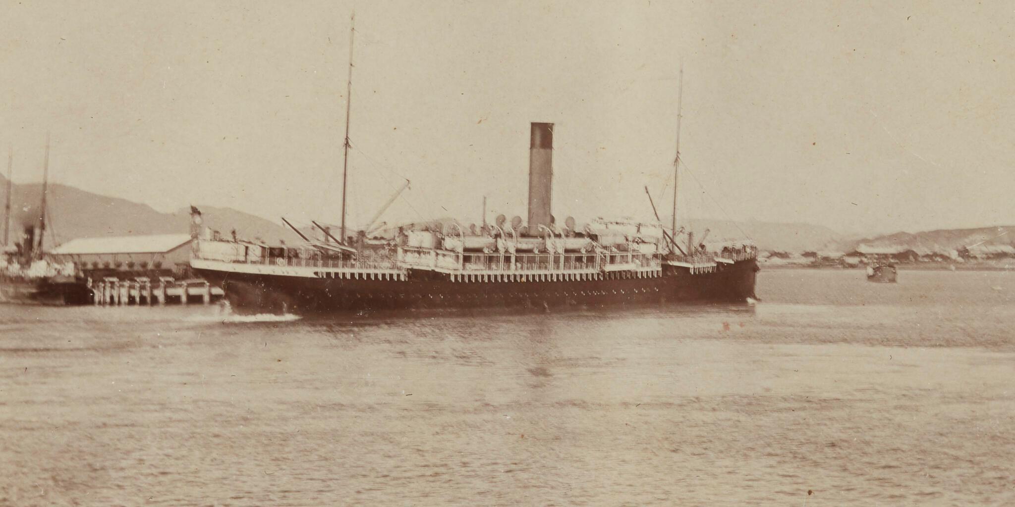 Black and white photograph showing a boat.