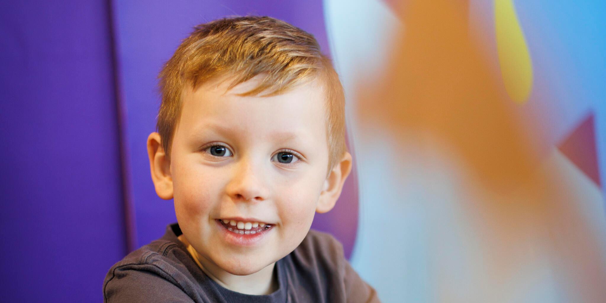 A young boy having fun in the creative space.