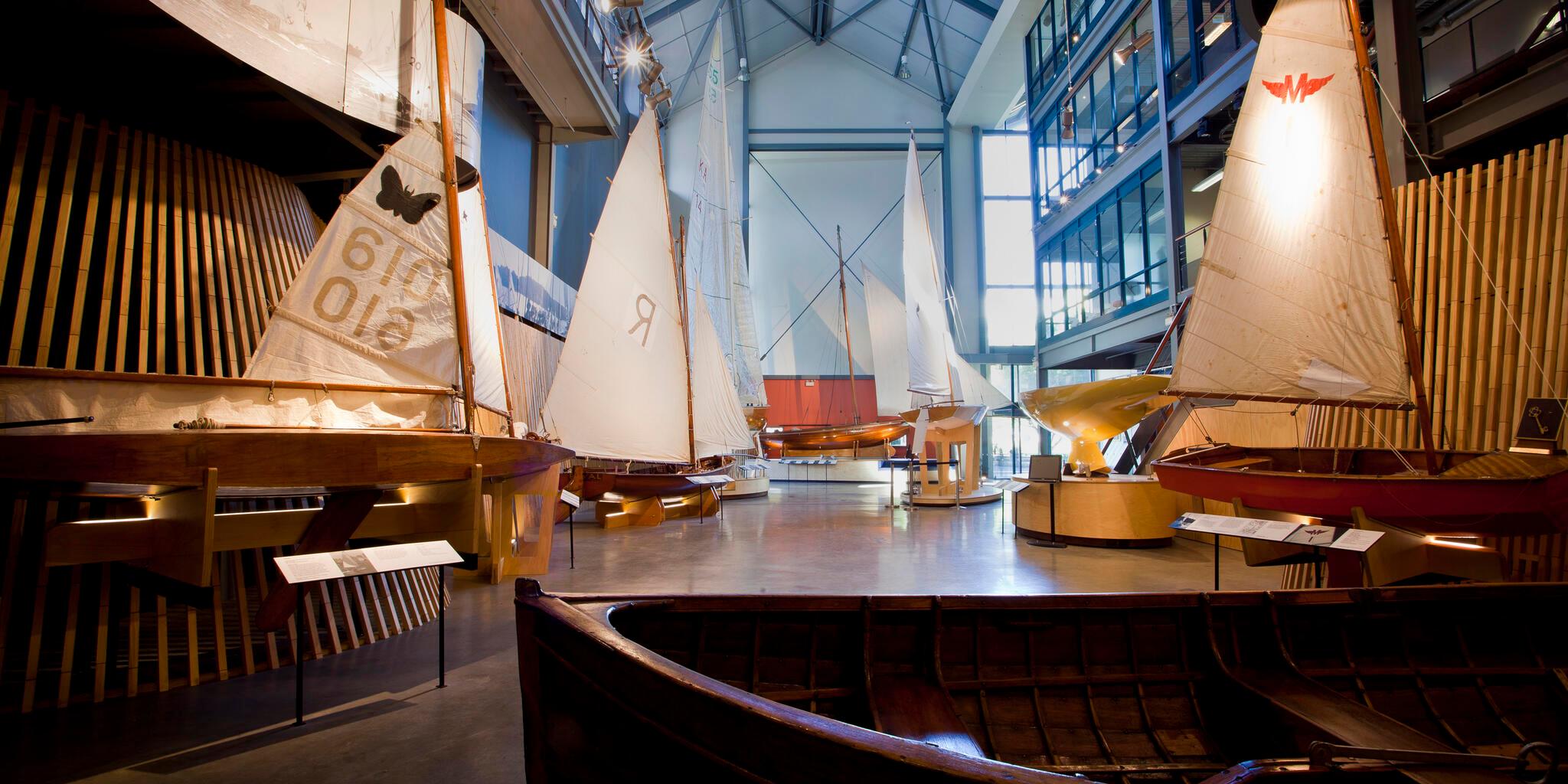 Interior views of the Wharf 7 building foyer including small wooden sailing boats.