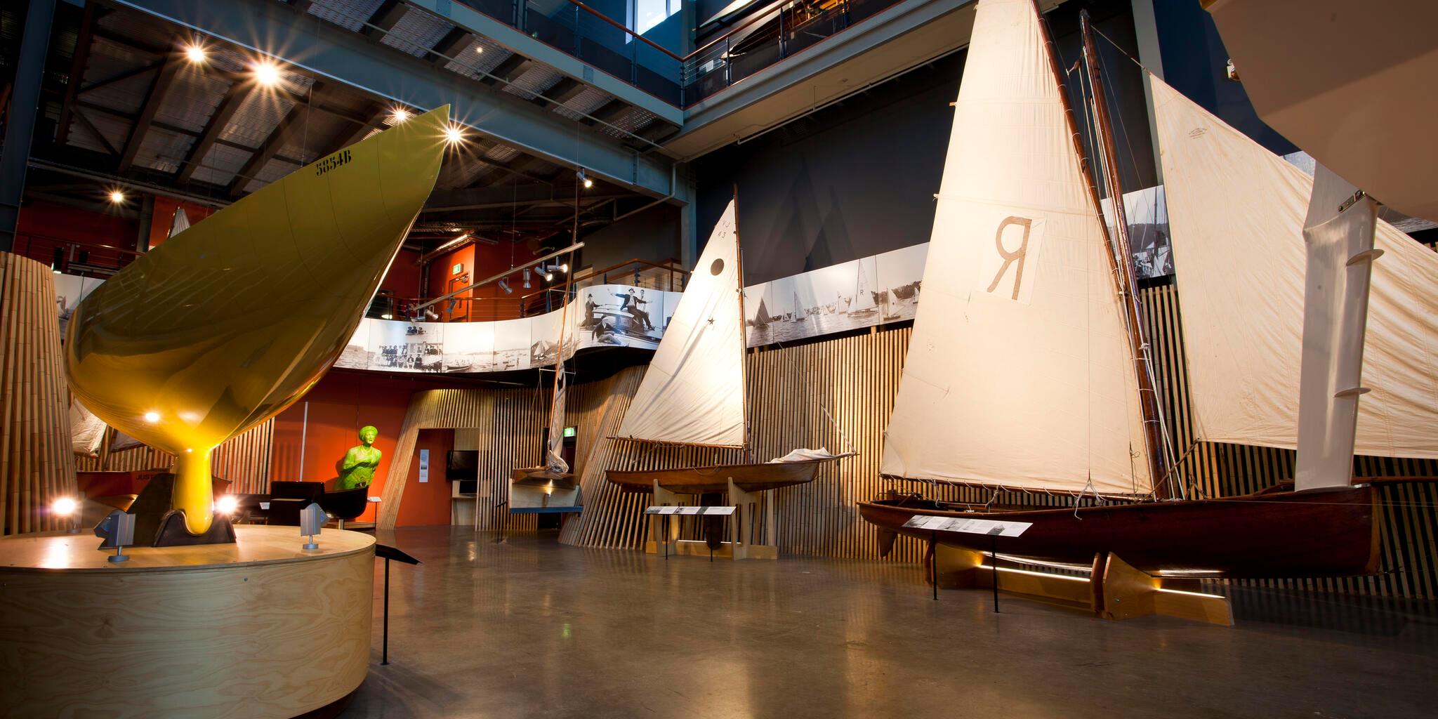 Interior views of the Wharf 7 building foyer including small wooden sailing boats.