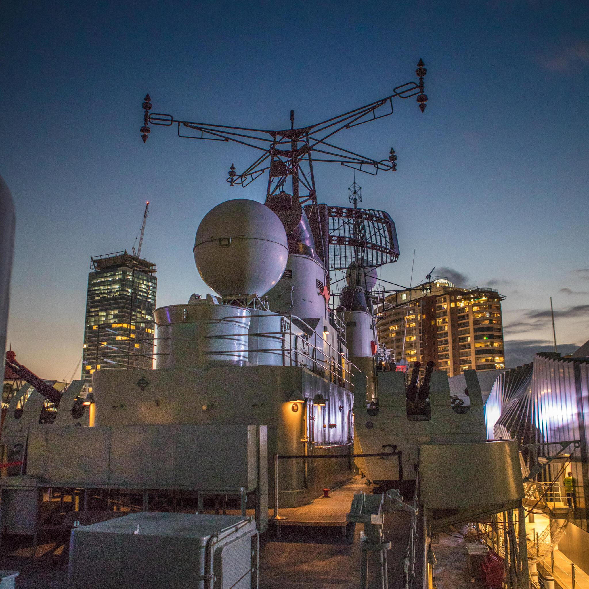 Deck of Navy destroyer HMAS Vampire at dusk. 