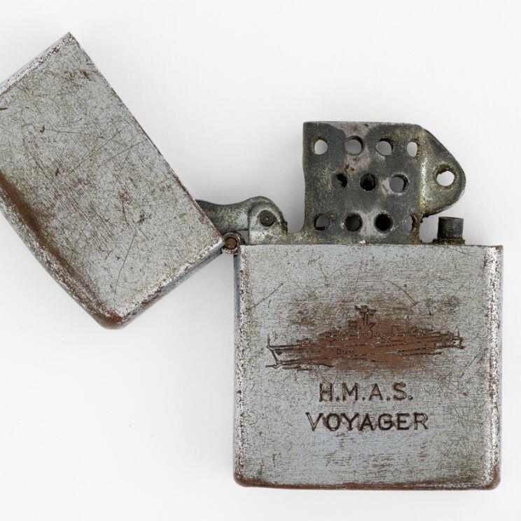 Cigarette lighter. Penguin. HMAS Voyager cigarette lighter. c.1964