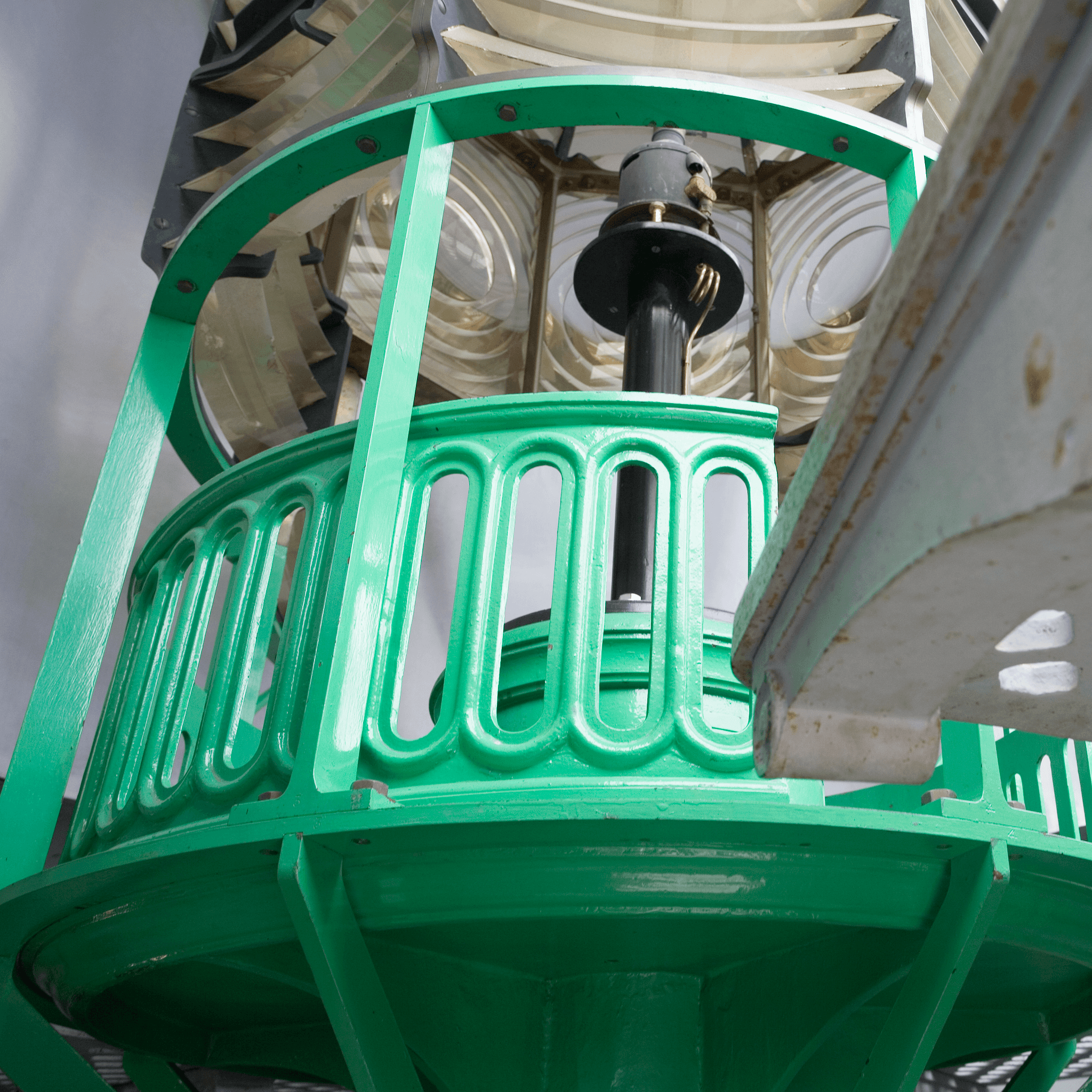 Detail of the lighthouse lantern lenses and green painted iron work.