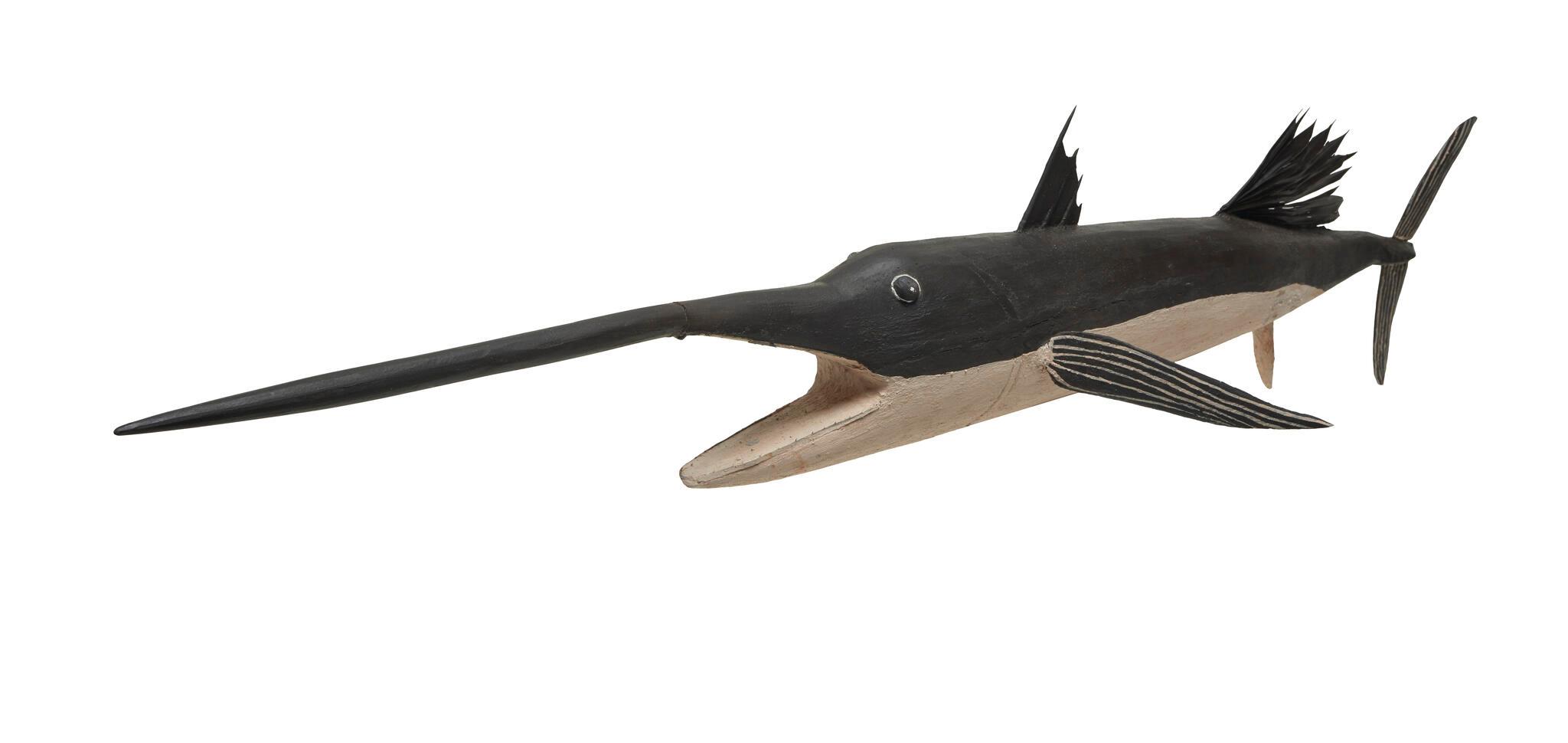 Wooden painted sailfish with prominent sword.