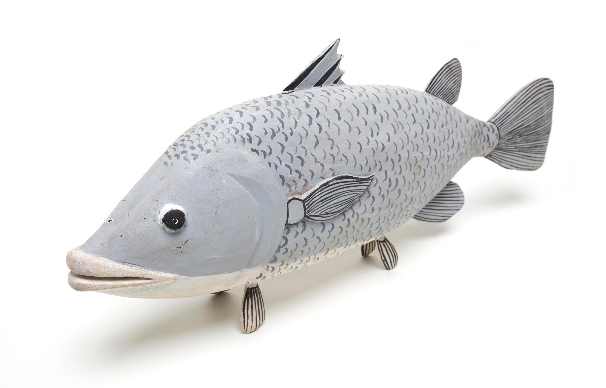 Pale grey wooden painted fish.