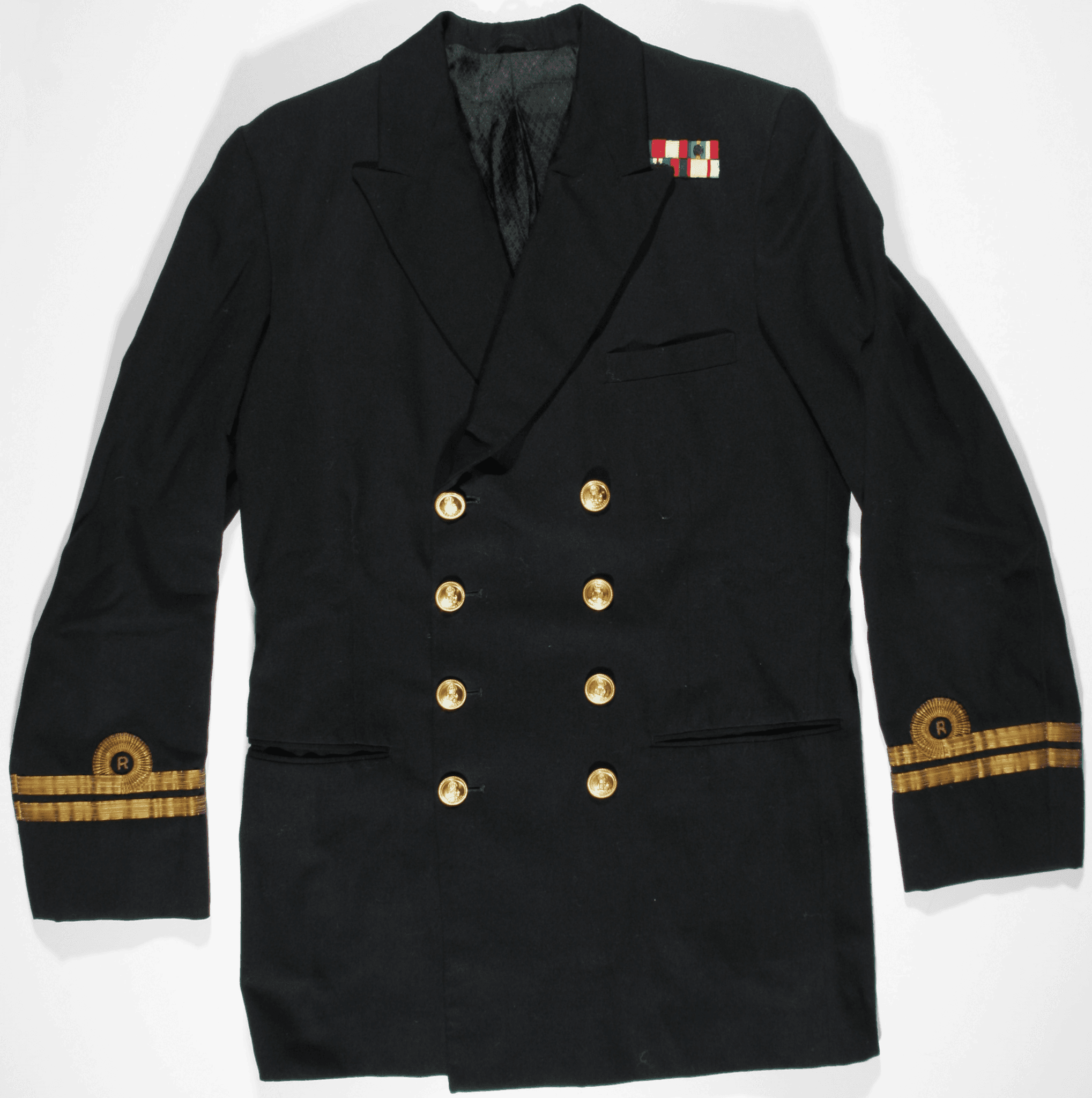 A black milirary jacket with gold buttons and decoration around the cuffs. There are small medal ribbon on the collar. 