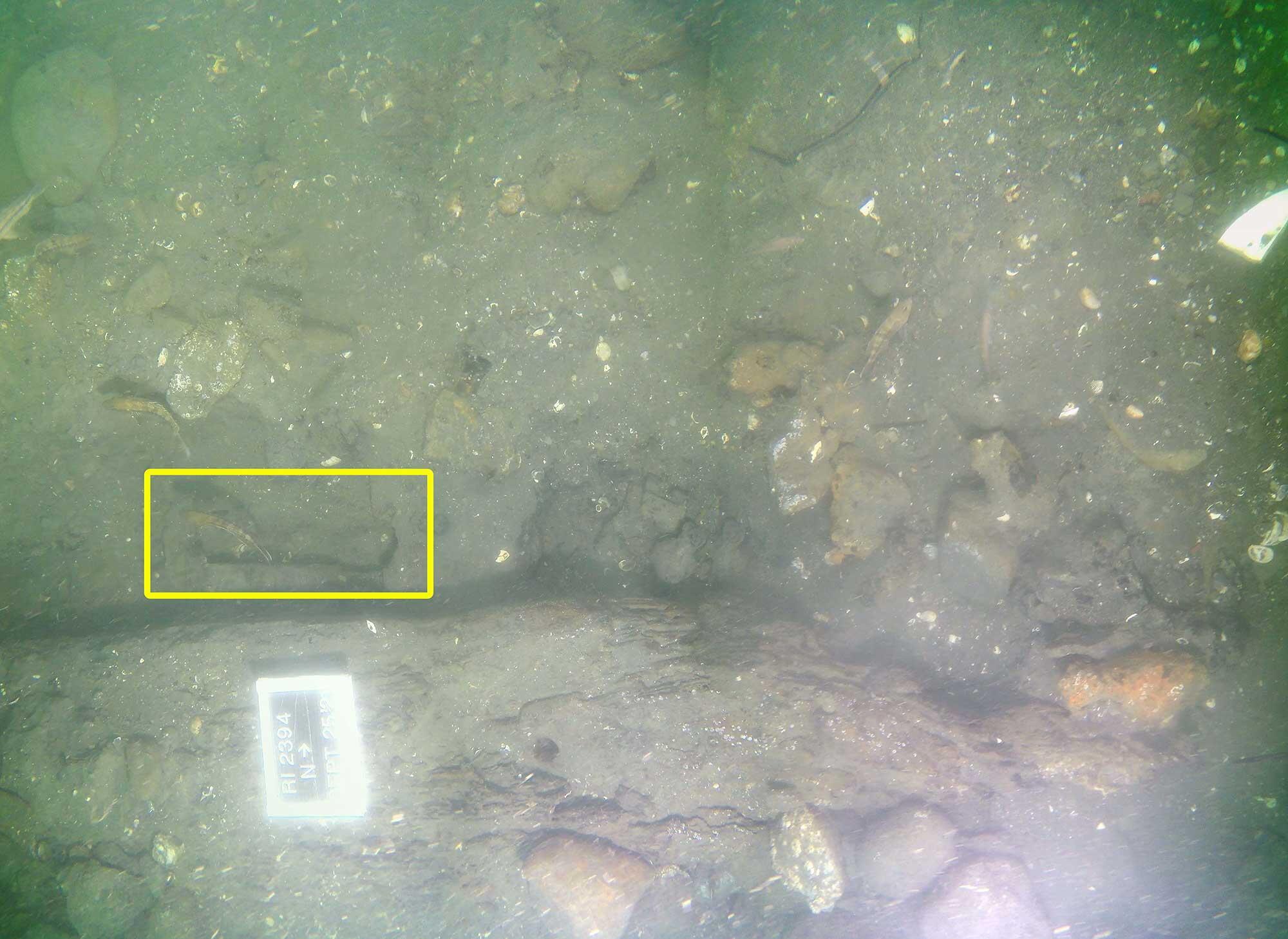 The scuttling hole found in RI 2394’s stern section in 2021 (highlighted by yellow rectangle) was created with a cutting tool.