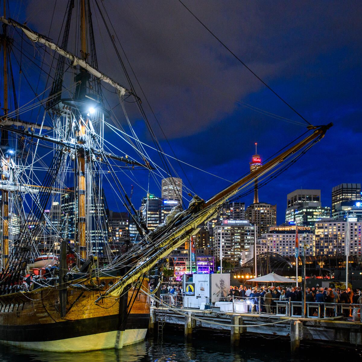 Endeavour at night with city skyline view