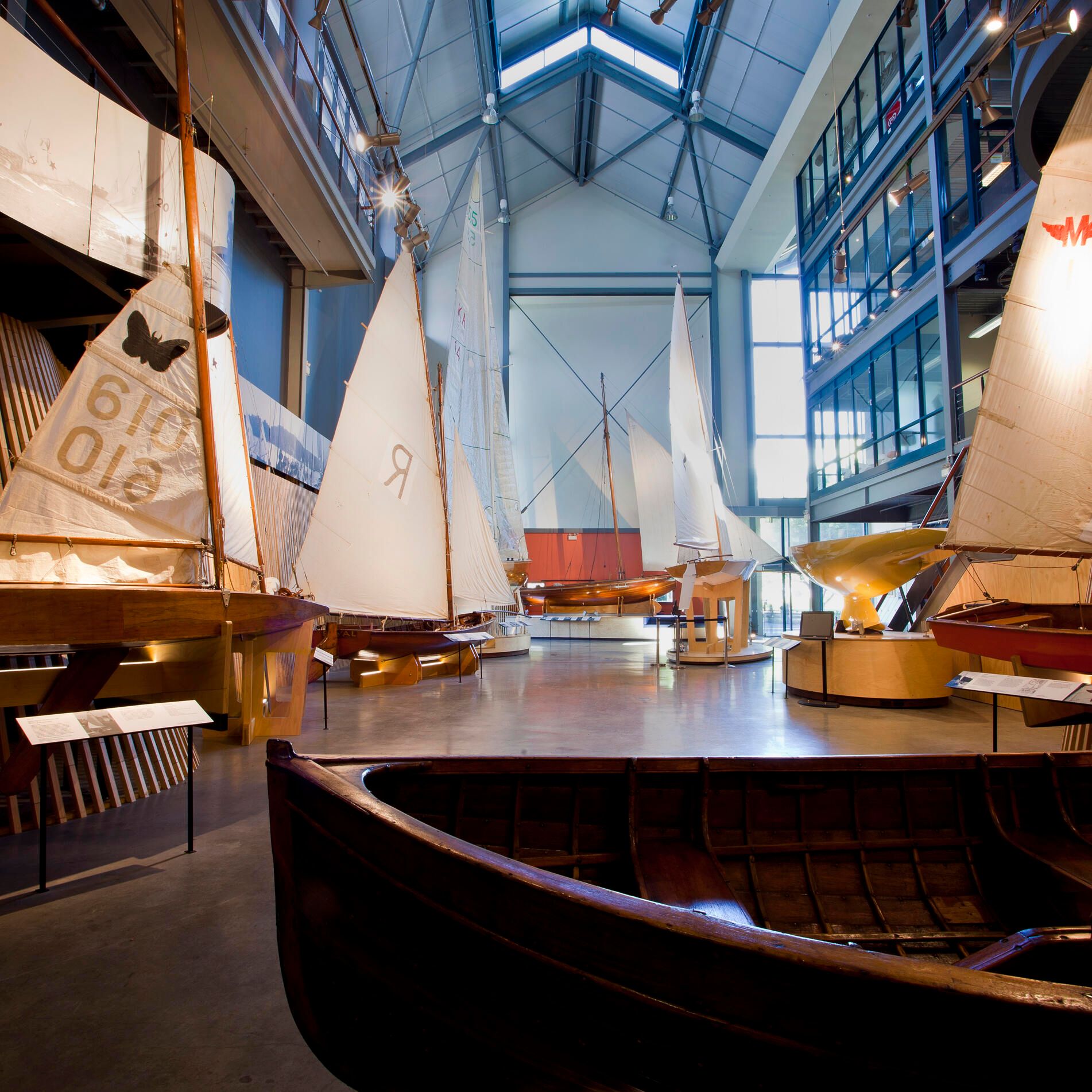 Interior views of the Wharf 7 building foyer including small wooden sailing boats.